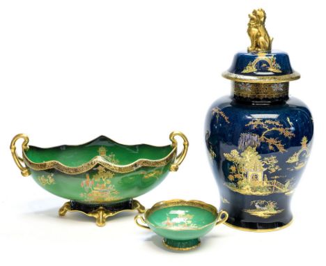 A Carlton Ware Bleu Royale, New Mikado temple vase, in the Chinese style, jewelled and gilded with pagodas in a garden landsc