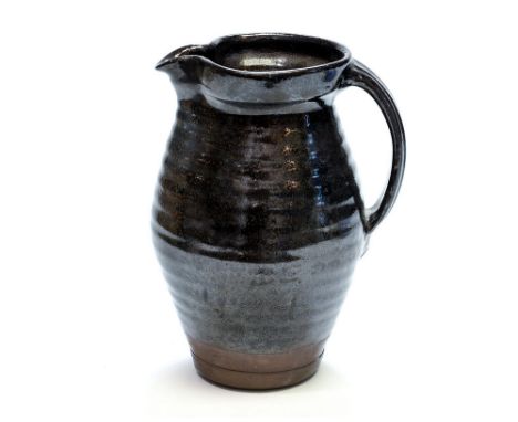 Leach Pottery, a St Ives studio pottery jug, ribbed ovoid form with Tenmoku glaze, probably David or Bernard Leach circa 1940