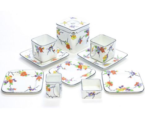 Robert Crawford Johnson, a Foley cube tea set, circa 1922, decorated with apple blossom design with multi coloured flowers, i