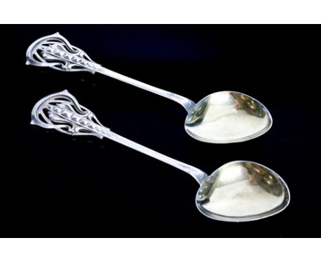 Attributed to Kate Harris for William Hutton and Sons, a pair of Arts and Crafts silver spoons in the Art Nouveau style, the 