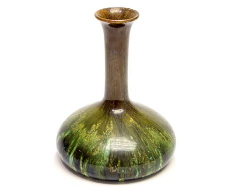 Christopher Dresser for Linthorpe, an art pottery vase, squat onion form with elongated neck, glazed in marbled green and bro