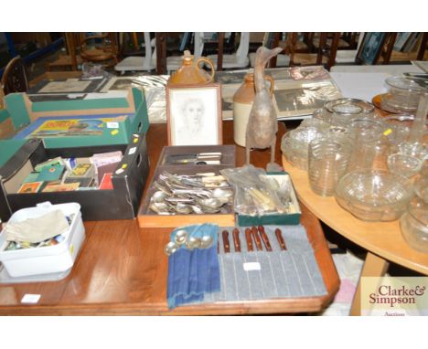 A quantity of various cutlery, wooden duck ornament, stoneware flagons, portrait