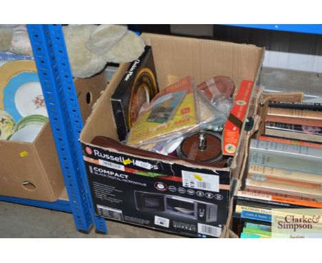 A box containing biscuit barrels, mugs, vintage magazines, marbles etc.