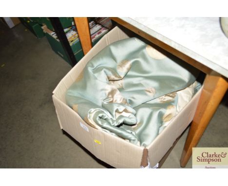 A box containing a pair of curtains