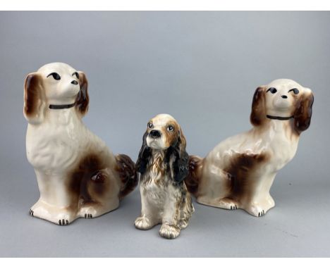 PAIR OF WALLY DOGS, 23cm high, along with two Art Deco style wall masks and a ceramic figure of a spaniel (5)