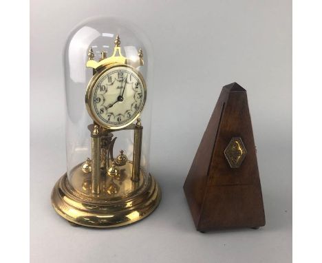 GERMAN ANNIVERSARY CLOCK, with glass dome, 31cm high overall, along with a Victorian metronome (2)