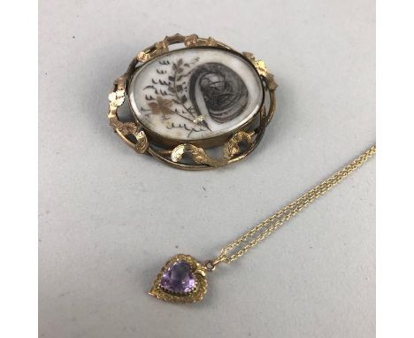 VICTORIAN OVAL MOURNING BROOCH, along with a gold and amethyst heart shaped pendant on chain
