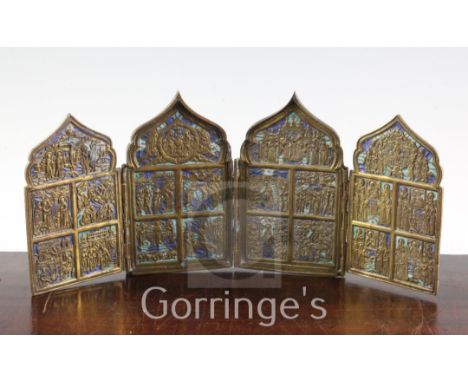 A 19th century Russian brass and champleve enamel four fold icon, each arched panel cast in relief with religious figures, wi
