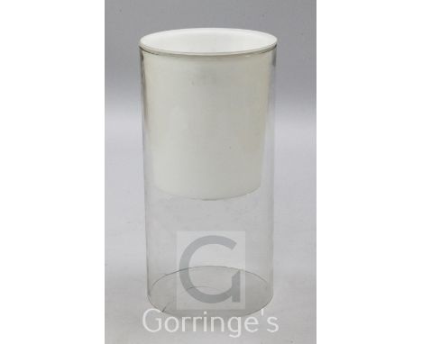 A Castiglioni glass uplighter and downlighter lamp, 1960's, in white frosted and clear glass, of cylindrical form, H.2ft