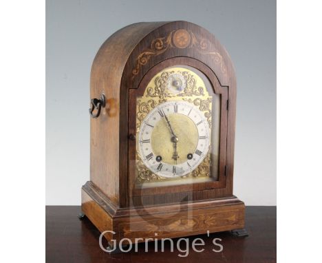 An Edwardian marquetry inlaid rosewood mantel clock, with lancet case and Winterhalder & Hofmeier movement, 14.5in.