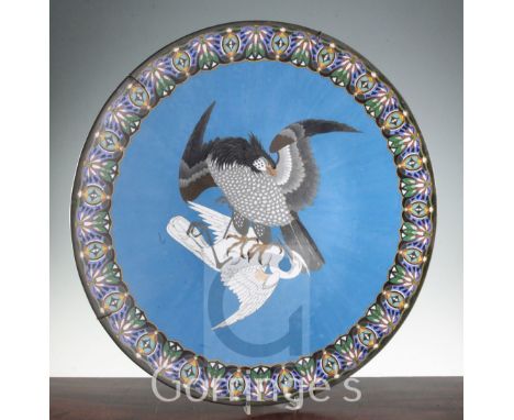 A large Japanese cloisonne enamel charger, Meiji period, decorated to the centre with an eagle attacking an egret on a blue g
