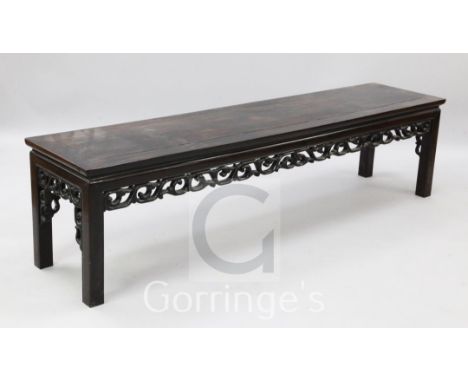 A Chinese hardwood low altar table, with scroll carved frieze, 6ft x 1ft 4in.