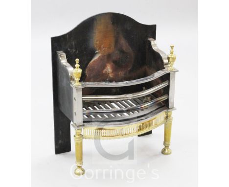 A Georgian style brass and steel fire grate, W.1ft 7in.