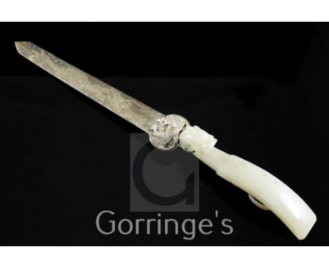 A Chinese pale celadon jade belt hook, mounted as a paperknife, 19th century, typical tapering form with a dragon head termin
