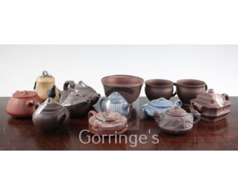 Ten Yixing pottery teapots and covers, two cups and a bowl, 20th century, the teapots of varying form, some moulded and some 