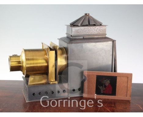 A collection of twenty one boxed lantern slide sets and a tin bodied magic lantern, late 19th / early 20th century, to includ