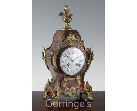 A French ormolu mounted red boulle mantel clock, 16in.