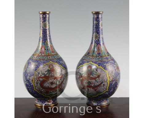 A pair of Chinese cloisonne enamel 'dragon' bottle vases, early 20th century, each decorated in gilded wirework with five cla