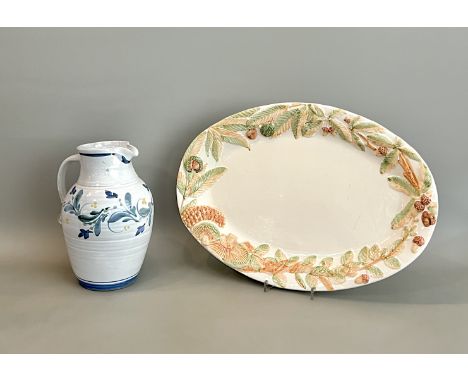 A Nicola Werner at Aldermaston Pottery stoneware studio pottery jug - painted potter's mark, painted with flowers on a blue a