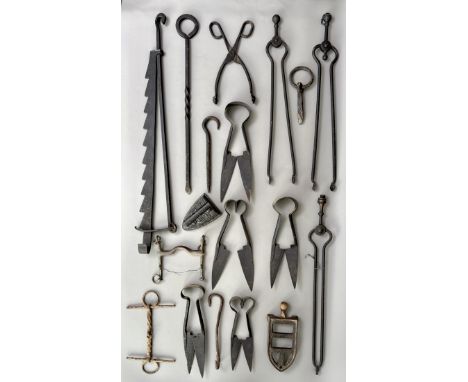 A collection of wrought iron down hearth tools - 19th / 20th century, including a spit jack; four pairs of fire tongs; and a 