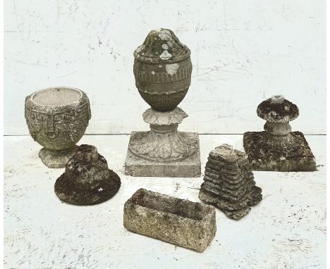 A small well weathered composite stone garden urn - with Greek key and vine fruit decoration, 26cm high; together with a soli