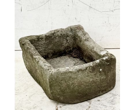 A well weathered, carved limestone D-shaped garden trough - 55.5 x 37cm, 18cm high.