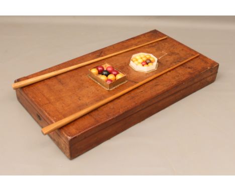 A Victorian mahogany cased folding bar billiards board - with green baize lining (a/f), two cues (one earlier in ash, the oth