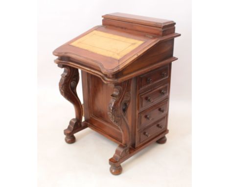A reproduction hardwood Davenport - late 20th century, the sloped front with inset leather writing surface, enclosing a fitte
