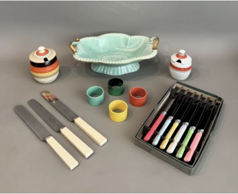 A small group of Art Deco period items - including a set of four coloured bakelite napkin rings; a Crown Devon celadon glazed