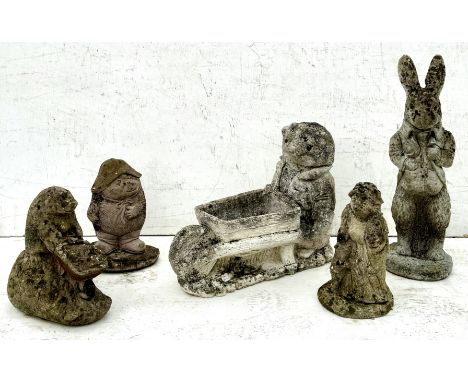 Five well weathered composite stone garden ornaments of zoomorphic figures - including three hedgehogs, Peter Rabbit and a mo
