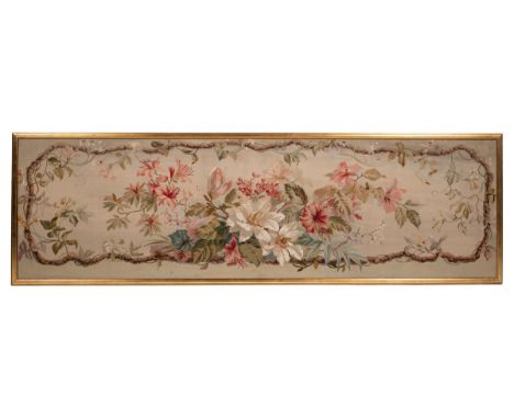An early 19th century French Aubusson style tapestry panel With floral designs.53cm x 182cmQty: 1Mounted in a modern gilded f