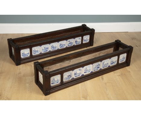 A pair of oak Delft jardinière planters The sides decorated with 18th century blue and white Delft tiles of coastal and rural