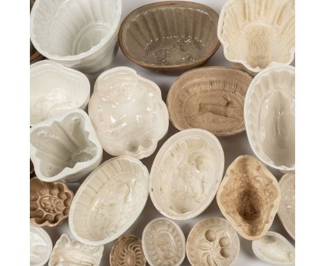 A collection of old ceramic jelly moulds The white glazed and stoneware jelly moulds of various designs.The largest approxima
