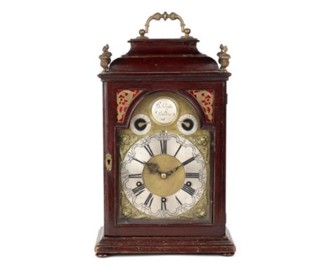 A bracket clock The 18th century scumbled pine case with a brass handle and finials, and with pierced and engraved brass pane