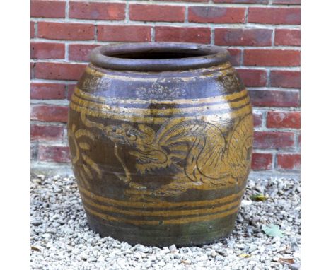 A Chinese glazed ovoid planter Decorated with a dragon.52cm diameter x 60cm highQty: 1In good, weathered condition.