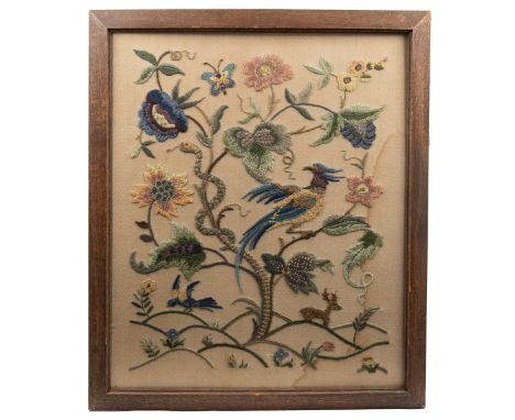 Two 20th century crewelwork panels One mounted into an oak fire screen, worked in coloured woollen threads on a linen ground,