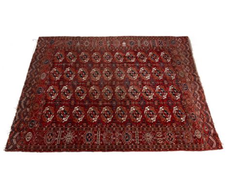 An early 20th century hand-woven Turkomen rug With a red ground and an all-over qum pattern.298cm x 219cmQty: 1From the estat