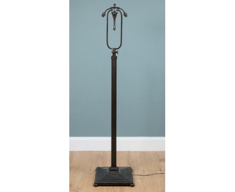 An early 20th century brass standard lamp The twin-branch, adjustable fitting raised on a fluted column support on a square s