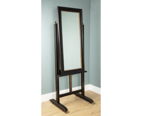 An ebonised easel later converted to a cheval mirror With turned finials and adjustable stand raised on castors.78cm wide x 6