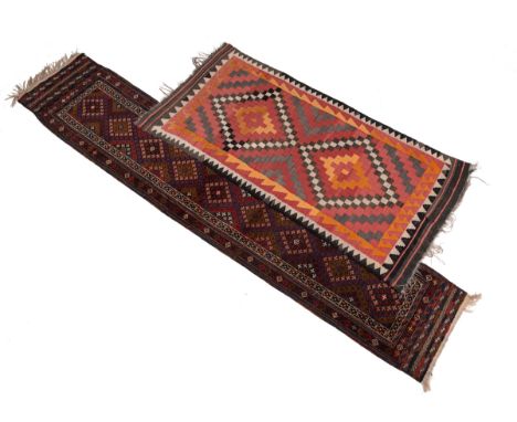 Two rugs The first a 20th century Persian Afshar style long runner with nine central medallions within a geometrical all-over