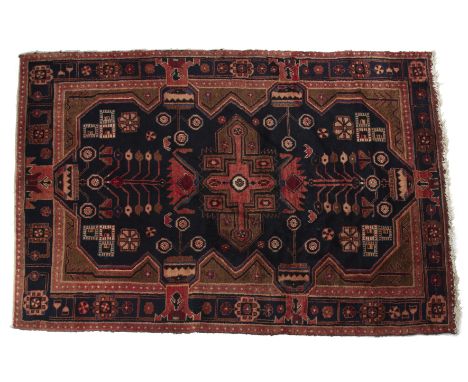 A Middle Eastern Hamadan woollen rug With a blue ground.205cm x 140cmQty: 1generally good condition with some light wear to t