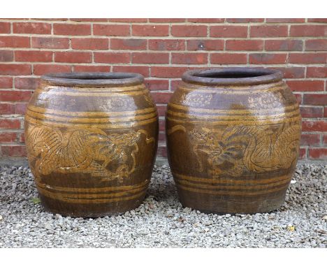A pair of Chinese ceramic garden planters Of ovoid form and decorated with dragons.62cm diameter x 66cm highQty: 2In generall