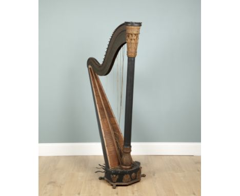 A 19th century Egyptian revival ebonised Harp By I &amp; I Erat of Berners Street, London. With gilt gesso decoration to the 
