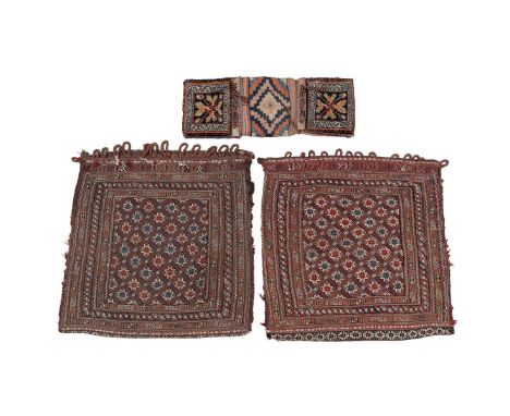 A collection of saddlebags To consist of a pair of Afghan hand-knotted split apart from a single saddlebag, the central groun