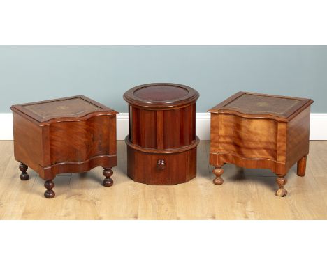 A group of three commodes To compirse a pair of Victorian walnut serpentine step commodes/bedside tables; and a leather inset