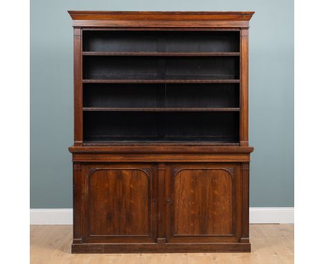 A Victorian rosewood two-tier bookcase The top with a cornice, the four egg and dart moulded shelves enclosed by pilasters, r