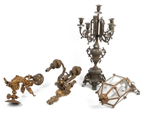 A collection of four bass lights A brass wall bracket modelled as a winged figure with a fish tail holding a lantern; a Neocl