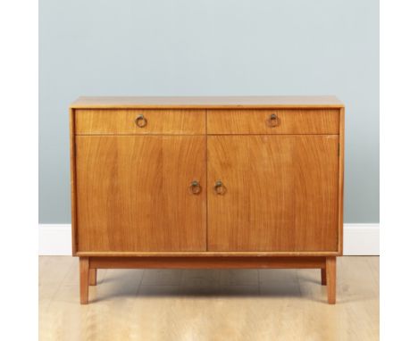 A mid-century Gordon Russell sideboard With two drawers with ring-pull handles, one drawer opening to reveal a fitted interio