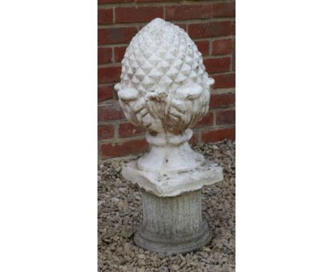 Three items of garden ornament A painted composite stone acanthus flower finial; together with a composite stone plinth; and 
