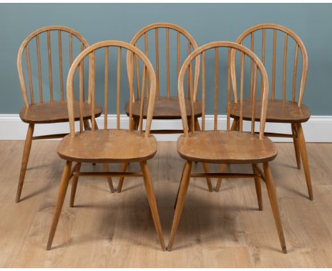A set of five Ercol light elm kitchen chairs With spindle backs.Each 43cm wide x 41cm deep x 83cm highQty: 5In good condition